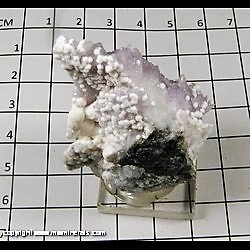 Mineral Specimen: Calcite on Amethyst from Guanajuato, Mexico Mineral Specimen: Calcite on Amethyst from Guanajuato, Mexico