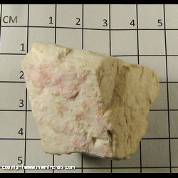 Mineral Specimen: Clinozoisite variety Clinothulite on Feldspar from Lawson Mine, Spruce Pine, Mitchell Co, North Carolina Mineral Specimen: Clinozoisite variety Clinothulite on Feldspar from Lawson Mine, Spruce Pine, Mitchell Co, North Carolina
