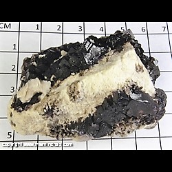 Mineral Specimen: Fluorite, Barite - fluoresces bright yellow - LW, Bitumen from Hardin Co,  Illinois