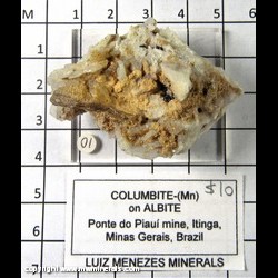 Mineral Specimen: Columbite-(Mn) on Albite from Ponte do Piaui mine, Itinga, Minas Gerais, Brazil