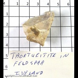Mineral Specimen: Thortveitite (thin, gray/green), Feldspar from Iveland, Agder, Norway Mineral Specimen: Thortveitite (thin, gray/green), Feldspar from Iveland, Agder, Norway