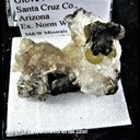 Mineral Specimen: Wulfenite and Psilomelane on Calcite from Glove Mine, Santa Cruz Co., Arizona, Ex. Norm Woods Mineral Specimen: Wulfenite and Psilomelane on Calcite from Glove Mine, Santa Cruz Co., Arizona, Ex. Norm Woods
