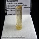 Mineral Specimen: Scapolite (UV fluorescent) from Marble occurrence, Morogoro, Uluguru Mts., Tanzania, Ex. Norm Woods Mineral Specimen: Scapolite (UV fluorescent) from Marble occurrence, Morogoro, Uluguru Mts., Tanzania, Ex. Norm Woods