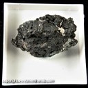 Mineral Specimen: Baddeleyite from Pocos de Caldas, Minas Gerais, Brazil, Ex. Luiz Menezes, (micromount box - 25 x 25 mm) Mineral Specimen: Baddeleyite from Pocos de Caldas, Minas Gerais, Brazil, Ex. Luiz Menezes, (micromount box - 25 x 25 mm)