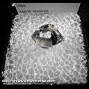 Mineral Specimen: Quartz variety: Herkimer Diamond with included Hyrdocarbon, Gas/Water Bubbles from Herkimer, New York, Collected by Linda Hermes, 1969 Mineral Specimen: Quartz variety: Herkimer Diamond with included Hyrdocarbon, Gas/Water Bubbles from Herkimer, New York, Collected by Linda Hermes, 1969