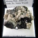 Mineral Specimen: Calcite on Specular Hematite from Great Western Mine, Three Peaks, Iron Springs Mining Dist., Iron Co., Utah, Ex. Norm Woods Mineral Specimen: Calcite on Specular Hematite from Great Western Mine, Three Peaks, Iron Springs Mining Dist., Iron Co., Utah, Ex. Norm Woods
