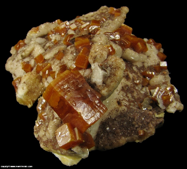 Mineral Specimen: Wulfenite, Descloizite on Calcite from Erupcion Mine, Ahumada, Sierra de Los Lamentos, Chihuahua, Mexico