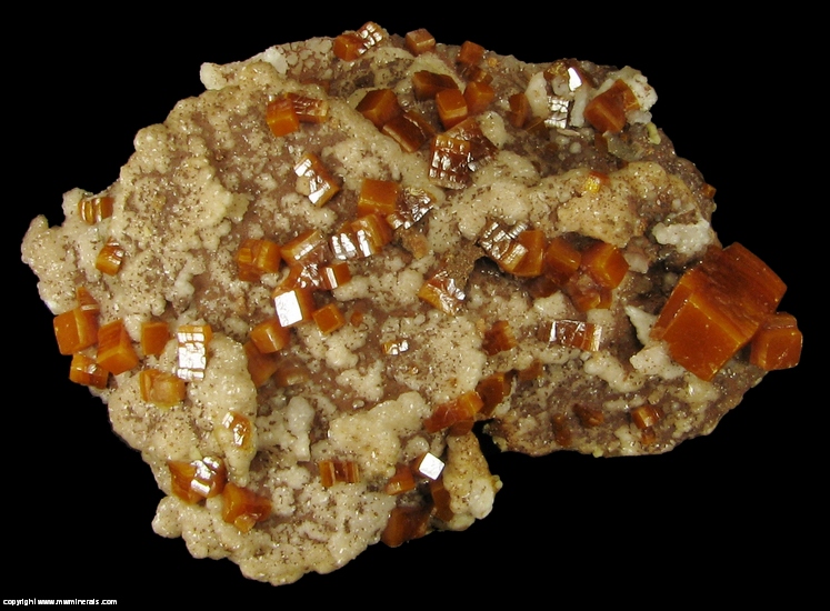 Mineral Specimen: Wulfenite, Descloizite on Calcite from Erupcion Mine, Ahumada, Sierra de Los Lamentos, Chihuahua, Mexico