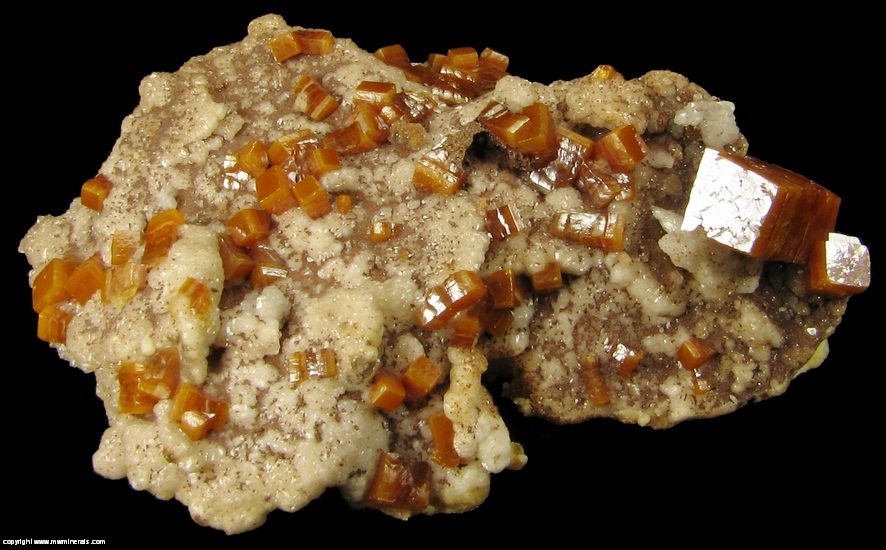 Mineral Specimen: Wulfenite, Descloizite on Calcite from Erupcion Mine, Ahumada, Sierra de Los Lamentos, Chihuahua, Mexico