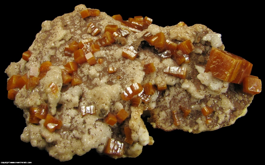 Mineral Specimen: Wulfenite, Descloizite on Calcite from Erupcion Mine, Ahumada, Sierra de Los Lamentos, Chihuahua, Mexico