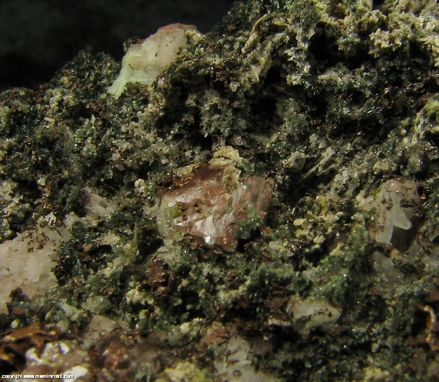 Mineral Specimen: Pumpellyite-Mg, Copper, Calcite with included Copper, Quartz and Microcline in Amygdule Basalt from Keweenaw Couny, Michigan, USA