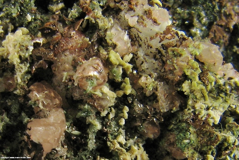 Mineral Specimen: Pumpellyite-Mg, Copper, Calcite with included Copper, Quartz and Microcline in Amygdule Basalt from Keweenaw Couny, Michigan, USA