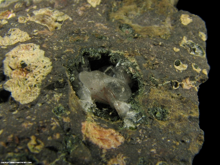 Mineral Specimen: Pumpellyite-Mg, Copper, Calcite with included Copper, Quartz and Microcline in Amygdule Basalt from Keweenaw Couny, Michigan, USA