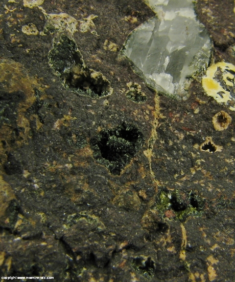 Mineral Specimen: Pumpellyite-Mg, Copper, Calcite with included Copper, Quartz and Microcline in Amygdule Basalt from Keweenaw Couny, Michigan, USA