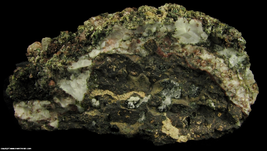 Mineral Specimen: Pumpellyite-Mg, Copper, Calcite with included Copper, Quartz and Microcline in Amygdule Basalt from Keweenaw Couny, Michigan, USA