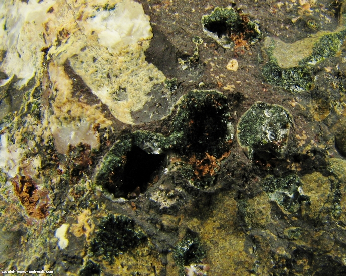 Mineral Specimen: Pumpellyite-Mg, Copper, Calcite with included Copper, Quartz and Microcline in Amygdule Basalt from Keweenaw Couny, Michigan, USA