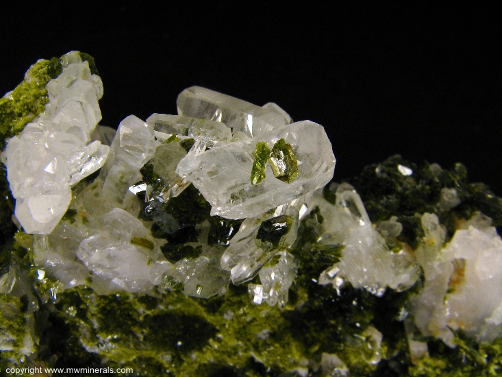 Mineral Specimen: Epidote on Quartz from Xichang Mine, Xichang County, Liangshan Autonomous Prefecture, Sichuan Province, China