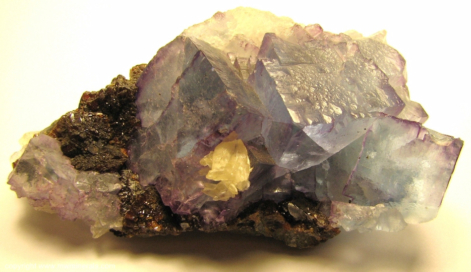 Mineral Specimen: Blue Fluorite with Purple edges with Sphalerite and Calcite from Cave-In-Rock, Hardin Co., Illinois