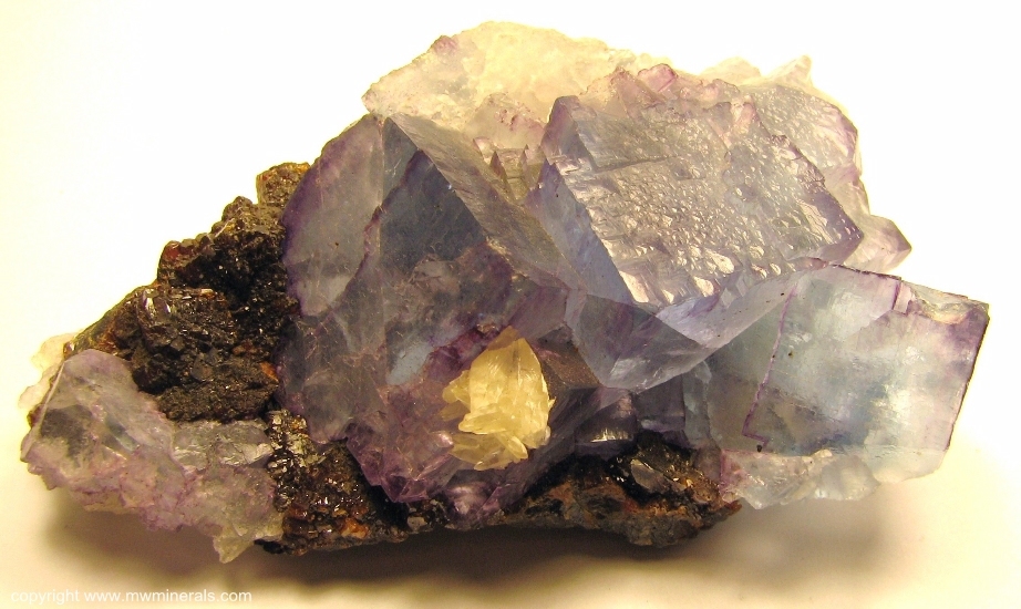 Mineral Specimen: Blue Fluorite with Purple edges with Sphalerite and Calcite from Cave-In-Rock, Hardin Co., Illinois
