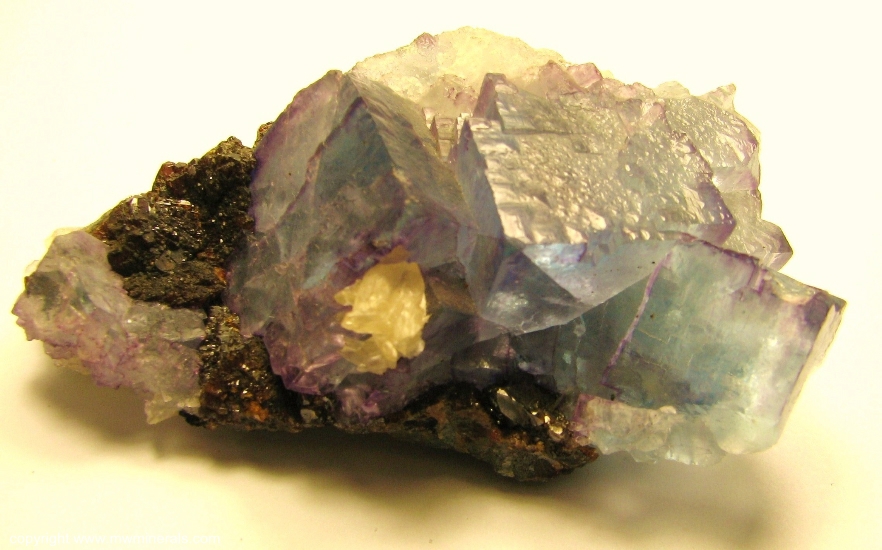 Mineral Specimen: Blue Fluorite with Purple edges with Sphalerite and Calcite from Cave-In-Rock, Hardin Co., Illinois