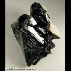 Minerals Specimen: Cassiterite Crystal with Albite from Linopolis, Divino das Laranjeiras, Minas Gerais, Brazil Minerals Specimen: Cassiterite Crystal with Albite from Linopolis, Divino das Laranjeiras, Minas Gerais, Brazil