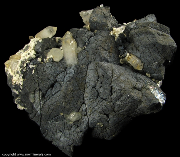 Mineral Specimen: Chalcopyrite and Quartz  on Hedenbergite from El Mochito Mine, El Mocho, Santa Barbara Department, Honduras