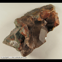 Minerals Specimen: Smoky Quartz, Orhoclase Coated with Hematite and Chlorite with Minor Pyrite from Sheahan Brothers Granite Quarry, Graniteville, Iron Co., Misssouri Minerals Specimen: Smoky Quartz, Orhoclase Coated with Hematite and Chlorite with Minor Pyrite from Sheahan Brothers Granite Quarry, Graniteville, Iron Co., Misssouri