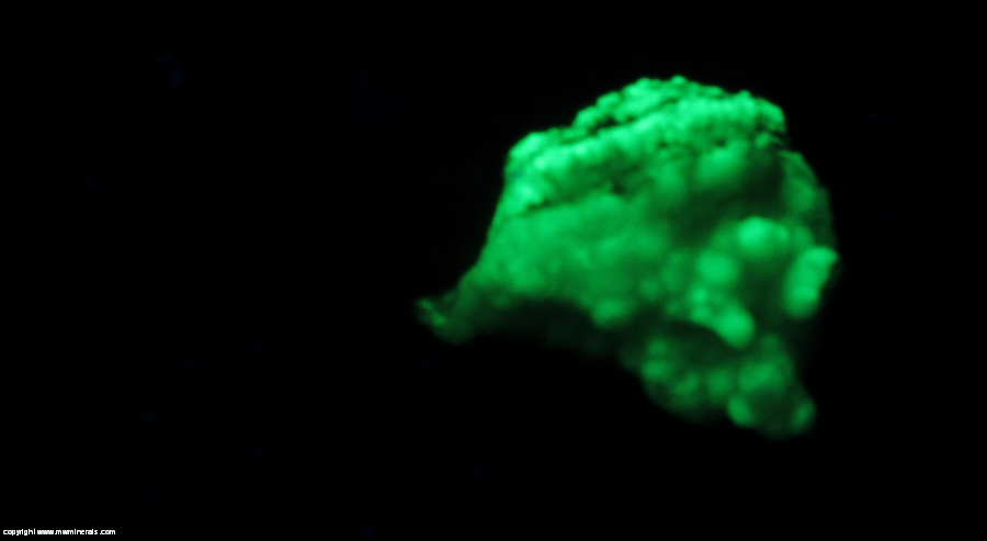 Fluorescent Mineral Specimen: Topaz with Included Rutile Partially Coated with Hyaline Opal from Tepate, San Luis Potosi, Mexico Fluorescent Mineral Specimen: Topaz with Included Rutile Partially Coated with Hyaline Opal from Tepate, San Luis Potosi, Mexico