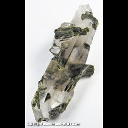 Mineral Specimen: Epidote Included in Double Terminated Quartz from Fazenda Rubin Pimenta Mine, Capelinha, Jequitinhonha valley, Minas Gerais, Brazil Mineral Specimen: Epidote Included in Double Terminated Quartz from Fazenda Rubin Pimenta Mine, Capelinha, Jequitinhonha valley, Minas Gerais, Brazil