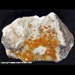 Minerals Specimen: Wulfenite on Calcite from Erupcion Mine, Ahumada, Sierra de Los Lamentos, Chihuahua, Mexico