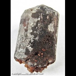 Mineral Specimen: Fluorapatite partially coated with Hematite and Calcite from Pea Ridge Mine, Sullivan, Washington Co., Missouri